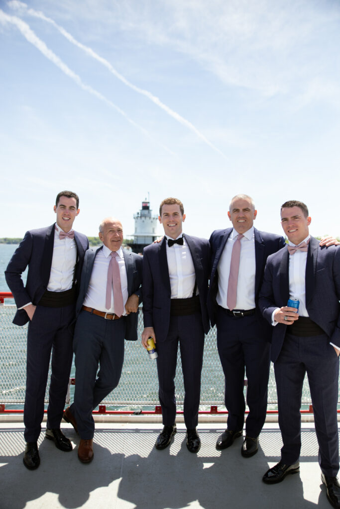 groomsmen on the ferry to the island 