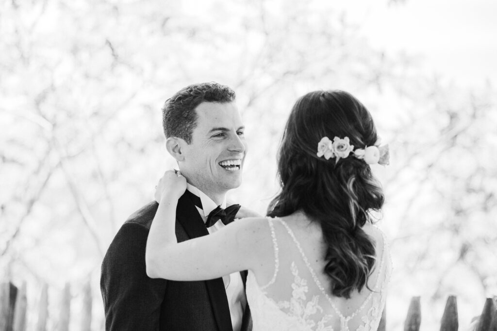 black and white first look of bride and groom