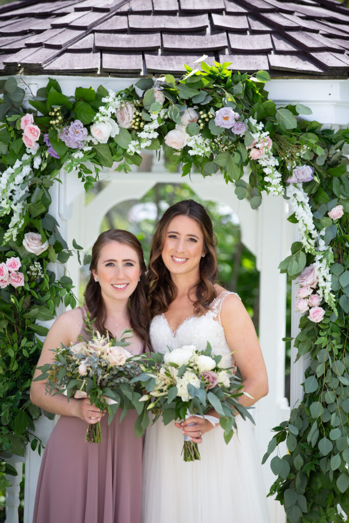 bride and her sister looking at the camera