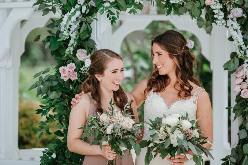 bride laughing with her sister