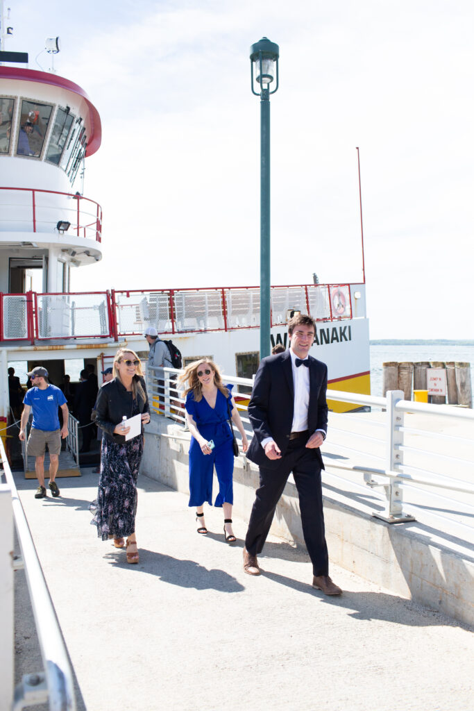 wedding guests arriving off of the ferry