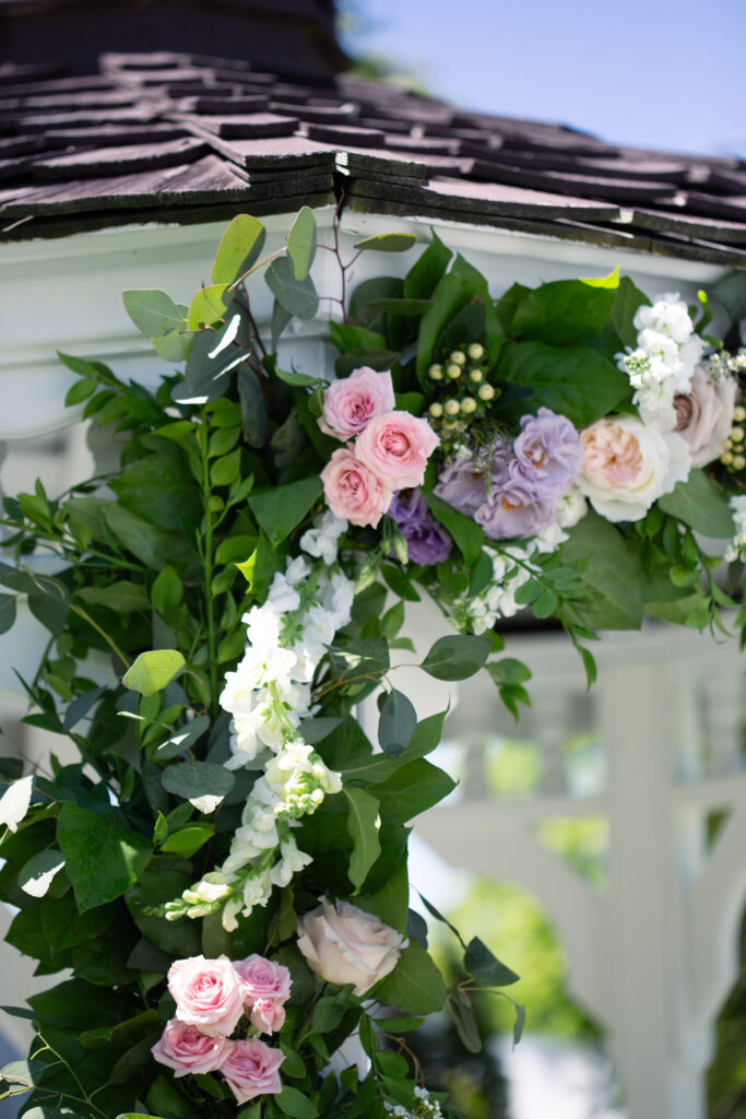 garland on gazebo with pink flowers 