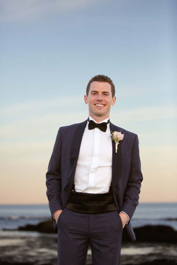 groom wearing bowtie and cummerbund 