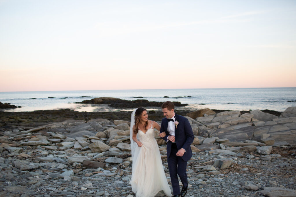 sunset with the bride and groom on the rocks 