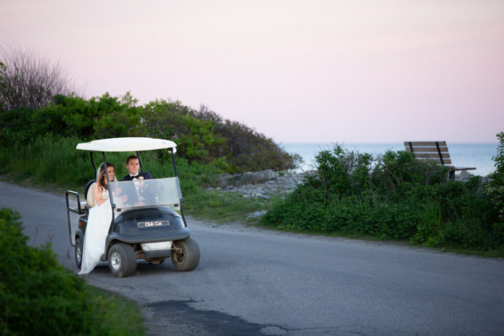 bride and groom driving the golf cart