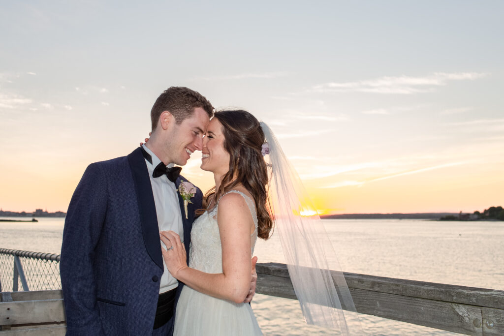 sunset with the bride and groom on the rocks 