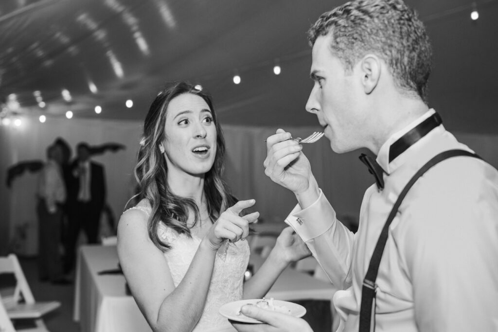 bride and groom cutting cake