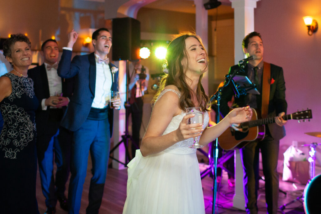 bride and groom dancing with friends