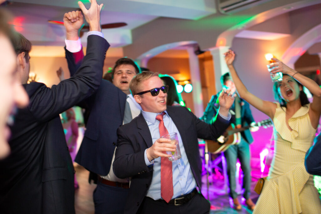 wedding guests dancing with friends