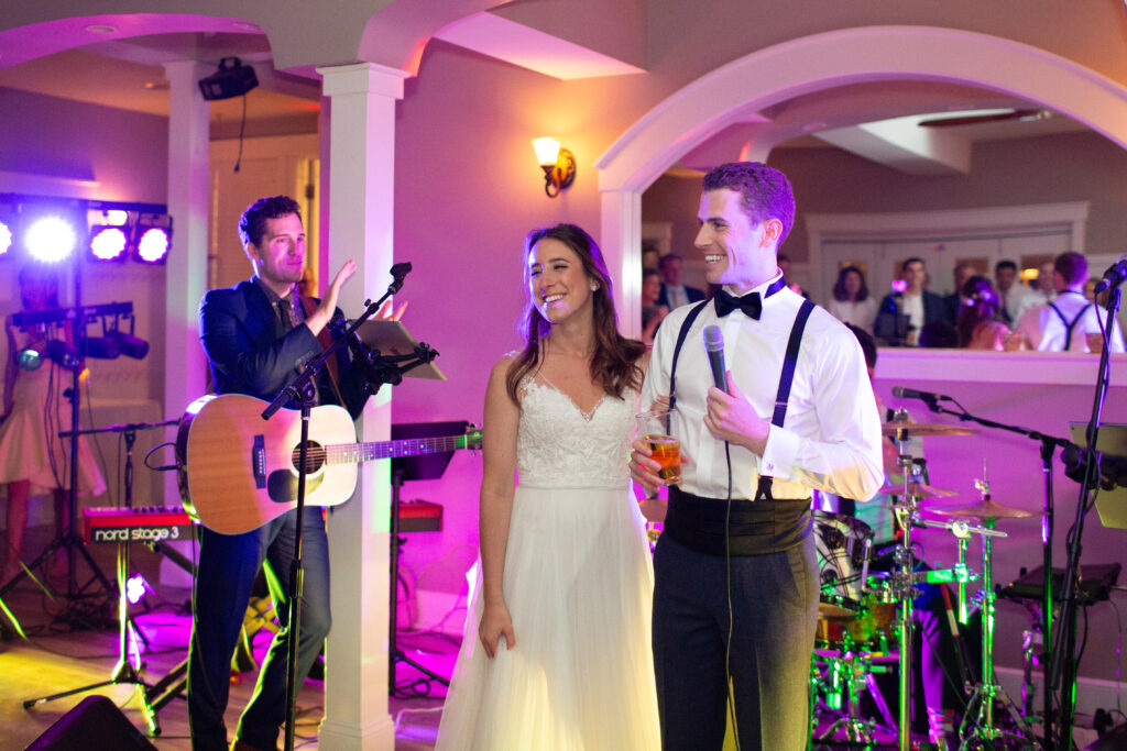 bride and groom dancing with friends