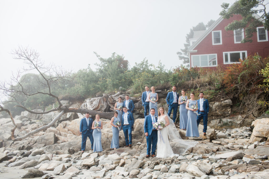 ding party on the rocks wearing blue suits and periwinkle dresses 