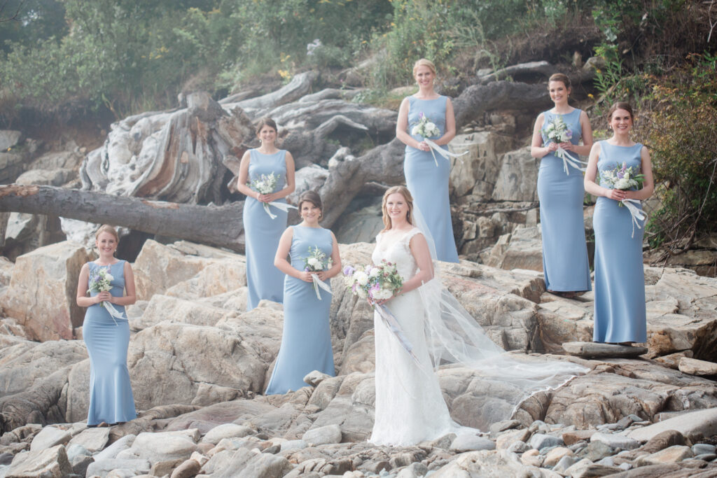 bridesmaids in periwinkle on rocks 