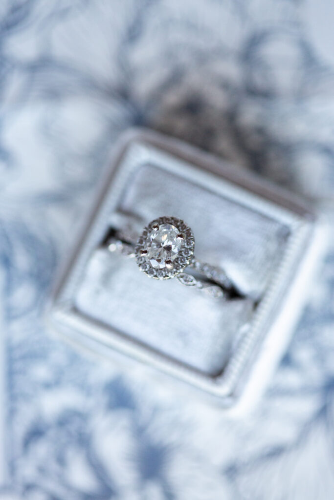 wedding and engagement ring in silver ring box