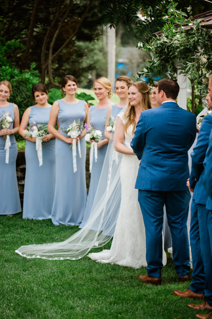 bride and groom looking at each other at wedding ceremony 