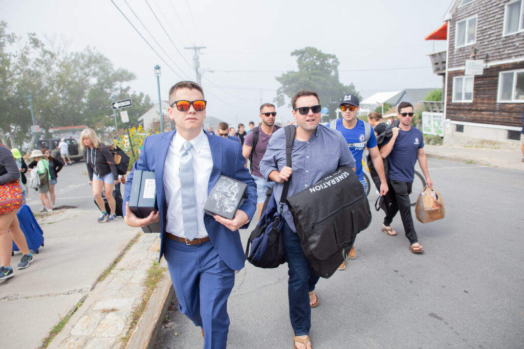 groomsmen arriving at the island with their suits