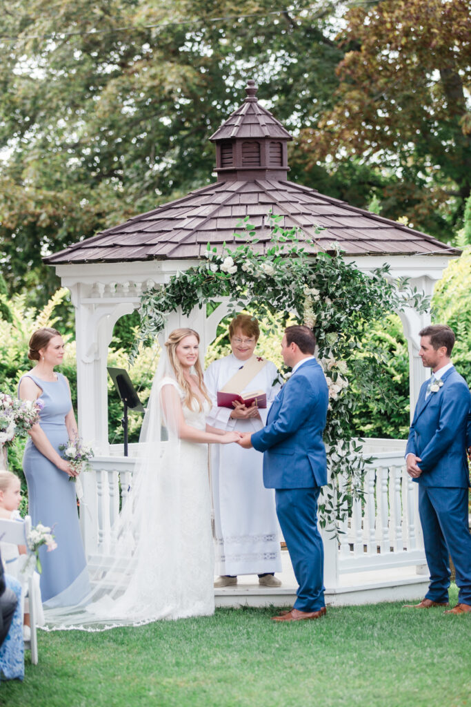 bride and groom looking at each other at wedding ceremony 