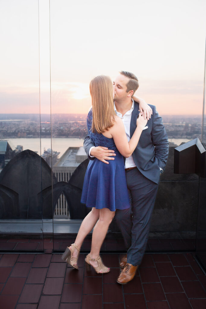 couple kissing at sunset 