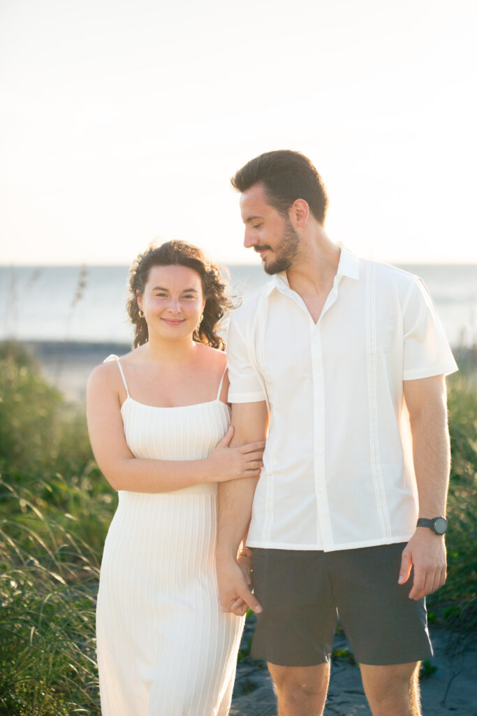 girl leaning on man holding mans arm 