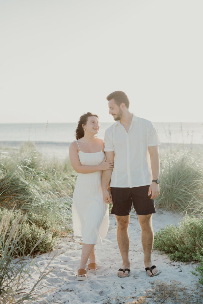 couple standing on the beach 