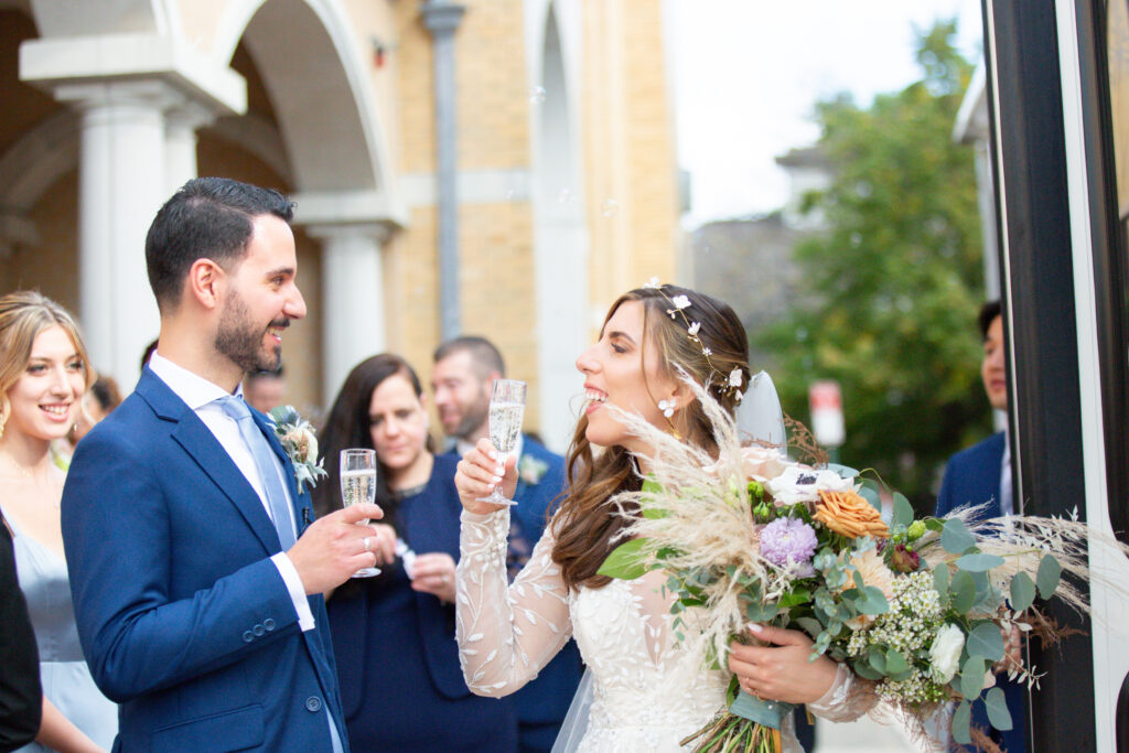 bride and groom laughing as they have their first toast 