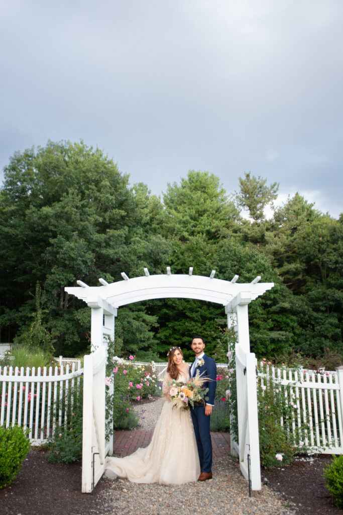 bride and groom in the rose garden 