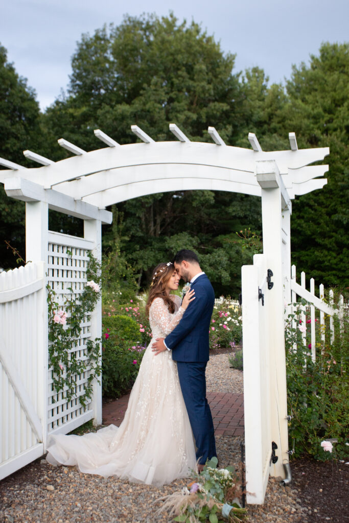 bride and groom in the rose garden 