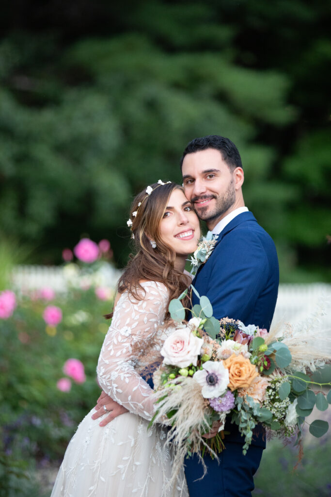 bride and groom in the rose garden 