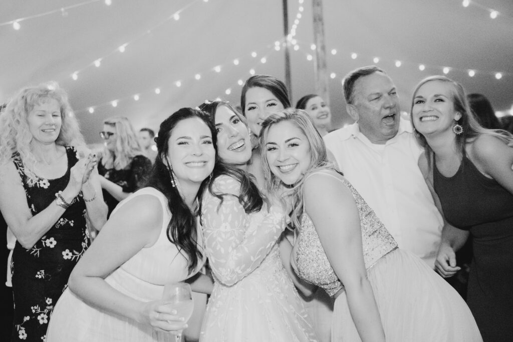 bride dancing with her friends at the reception 