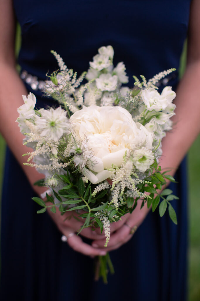 bridesmaid holding white flowers