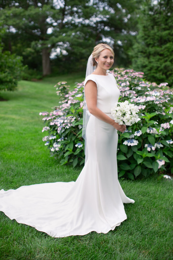 bride standing in the gardens 