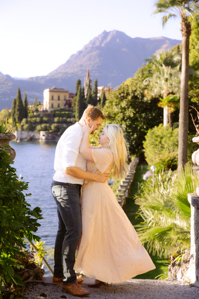 Couple in the gardens at Villa Monastero with the city in the background