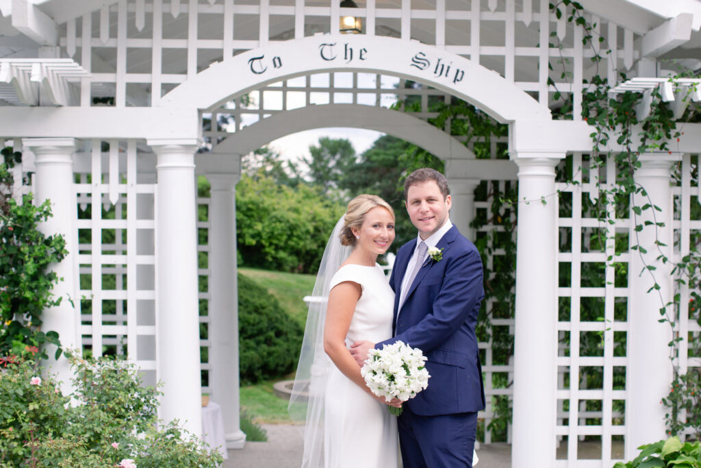 bride and groom standing in the garden  