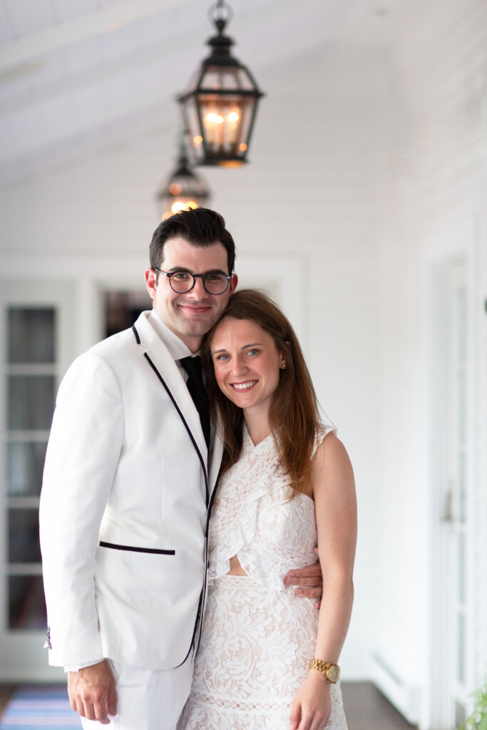 bride and groom wearing white on rehearsal dinner 