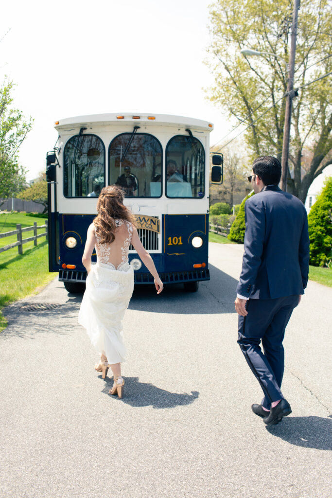 bride and groom getting in trolly 