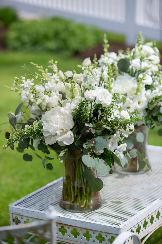 white flowers in vase on table 