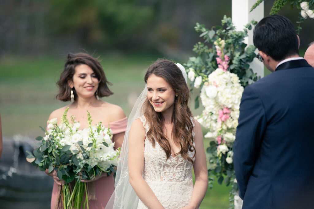 bride laughing during wedding ceremony 