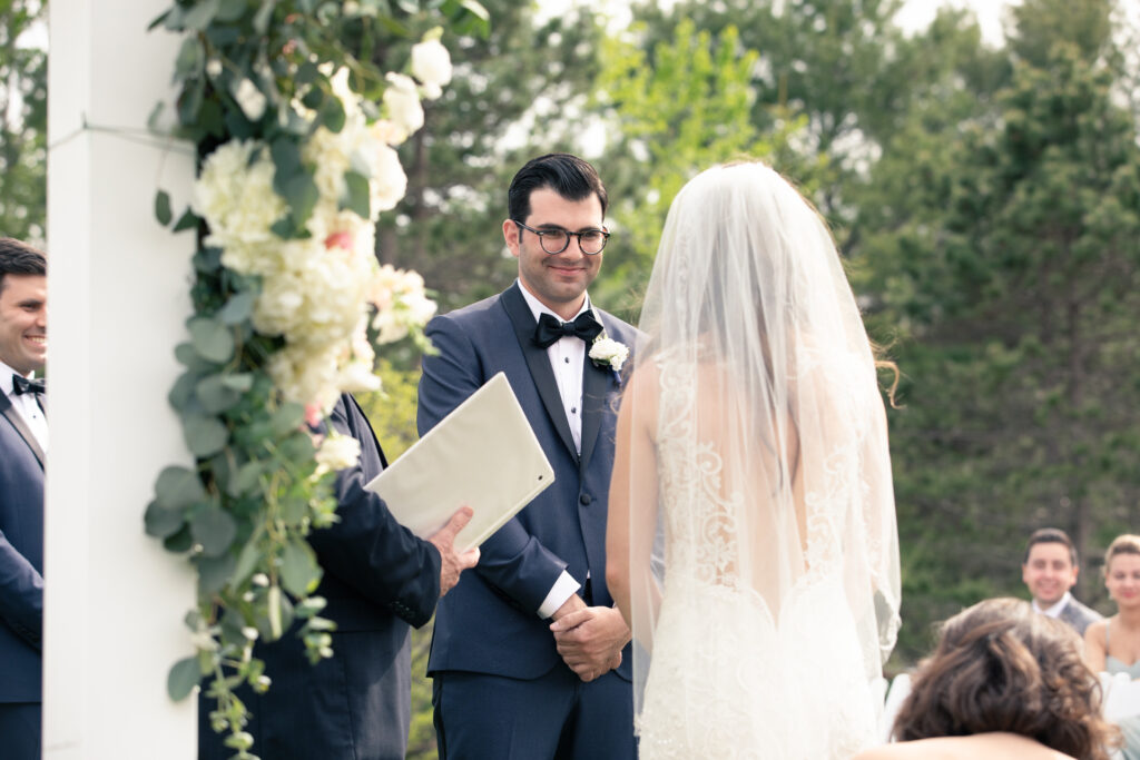 groom facing bride during wedding ceremony 