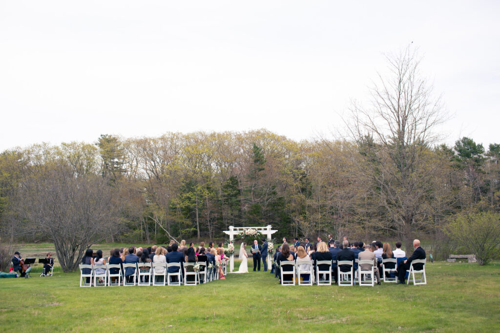 wedding ceremony from the end of the aisle 