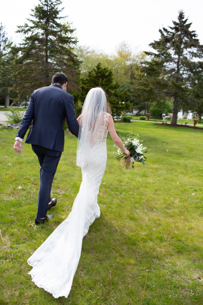 bride and groom from behind walking out of ceremony 