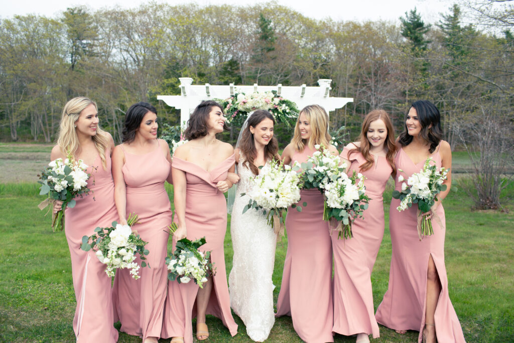 bridesmaids walking and laughing 