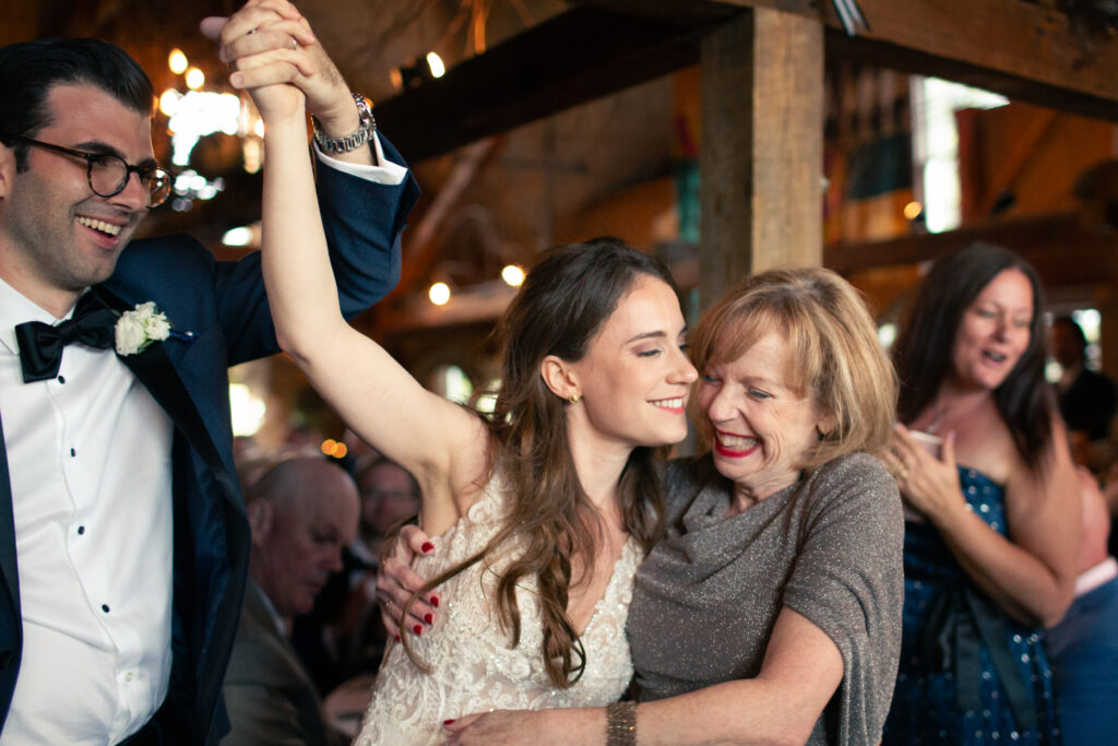 bride laughing with her mom 