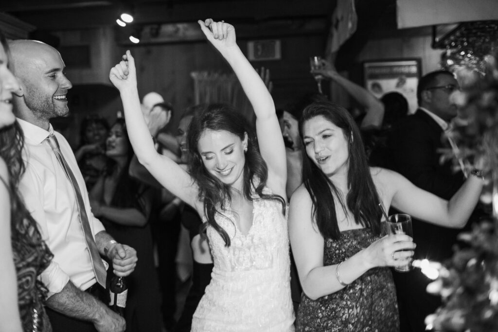 bride dancing with friends at wedding 