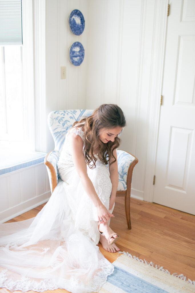 bride putting on shoes 