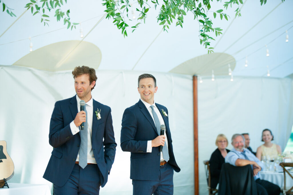 brides brothers giving wedding toast at reception