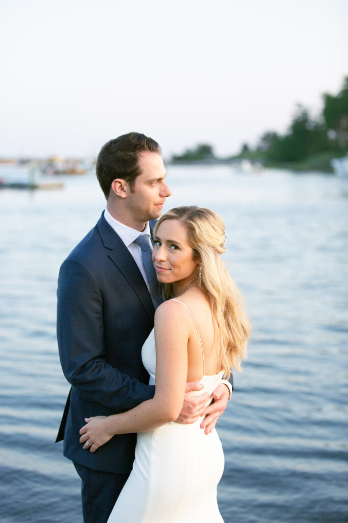 bride and groom on the beach at dusk 