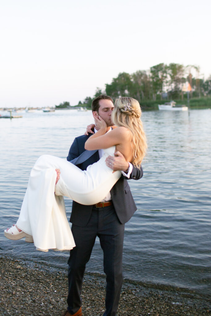 groom picked up the bride in his arms 