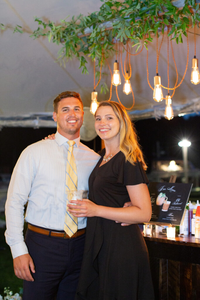 a couple at the wedding looking at camera 