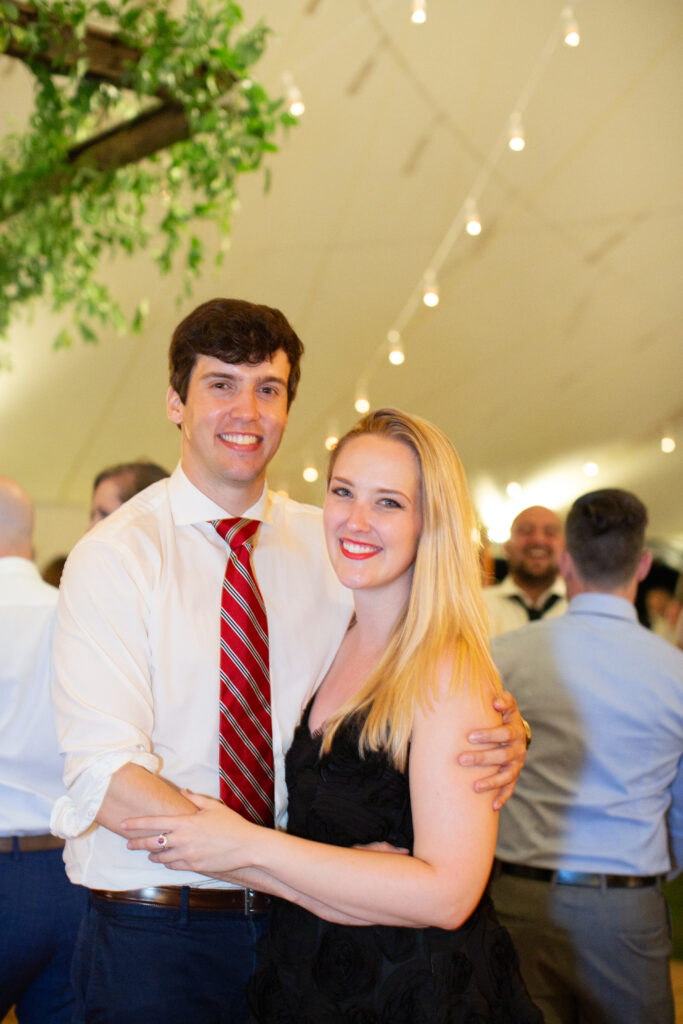 a couple at the wedding looking at camera 