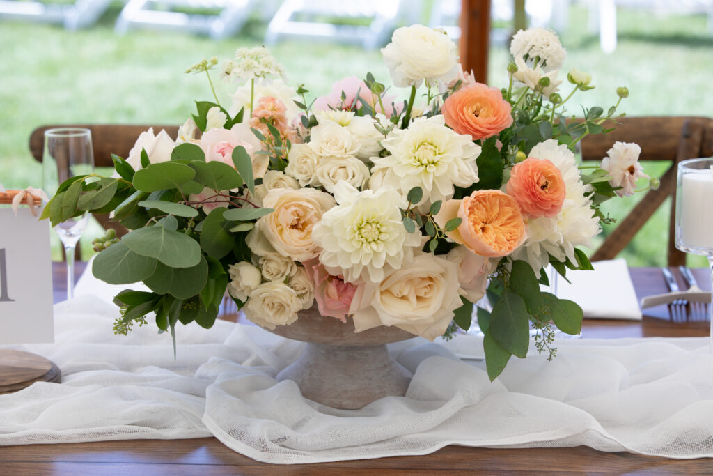 Floral centerpieces made from peonies, dahlias, and ranunculus flowers