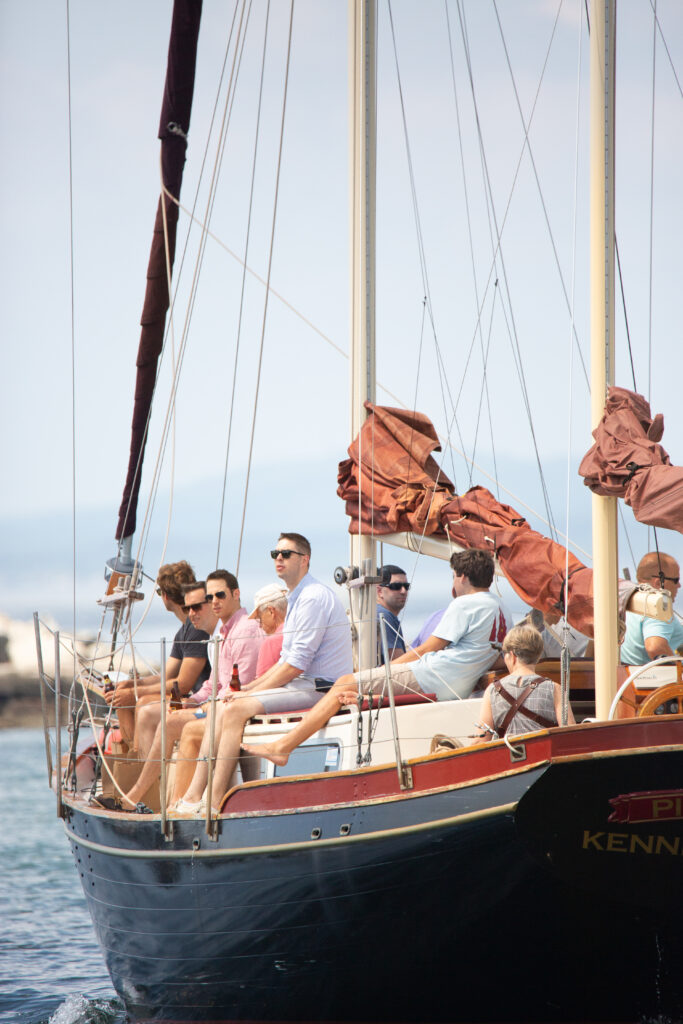 groomsmen on a sailboat